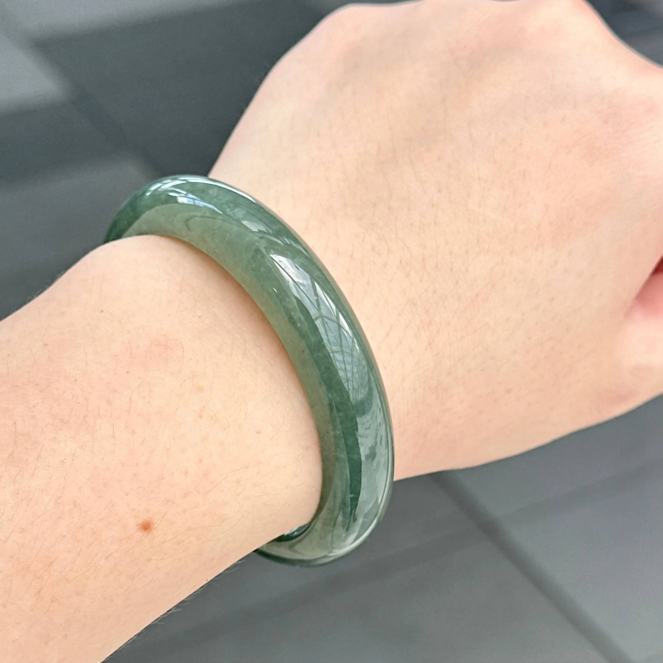 31957 56.6mm Emerald Ocean’s Whisper Bluish Green Jadeite Bangle