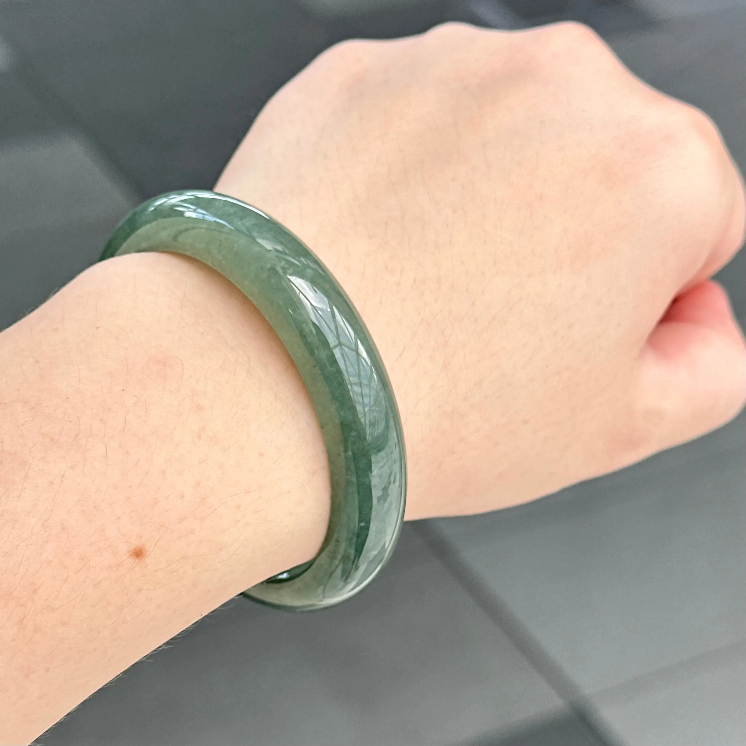 31957 56.6mm Emerald Ocean’s Whisper Bluish Green Jadeite Bangle