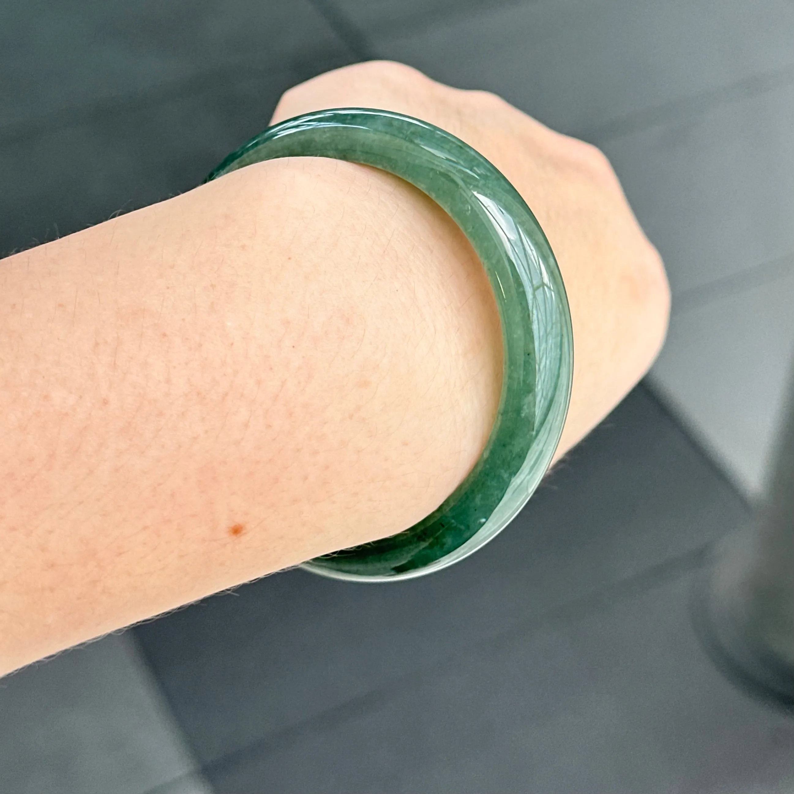 31957 56.6mm Emerald Ocean’s Whisper Bluish Green Jadeite Bangle