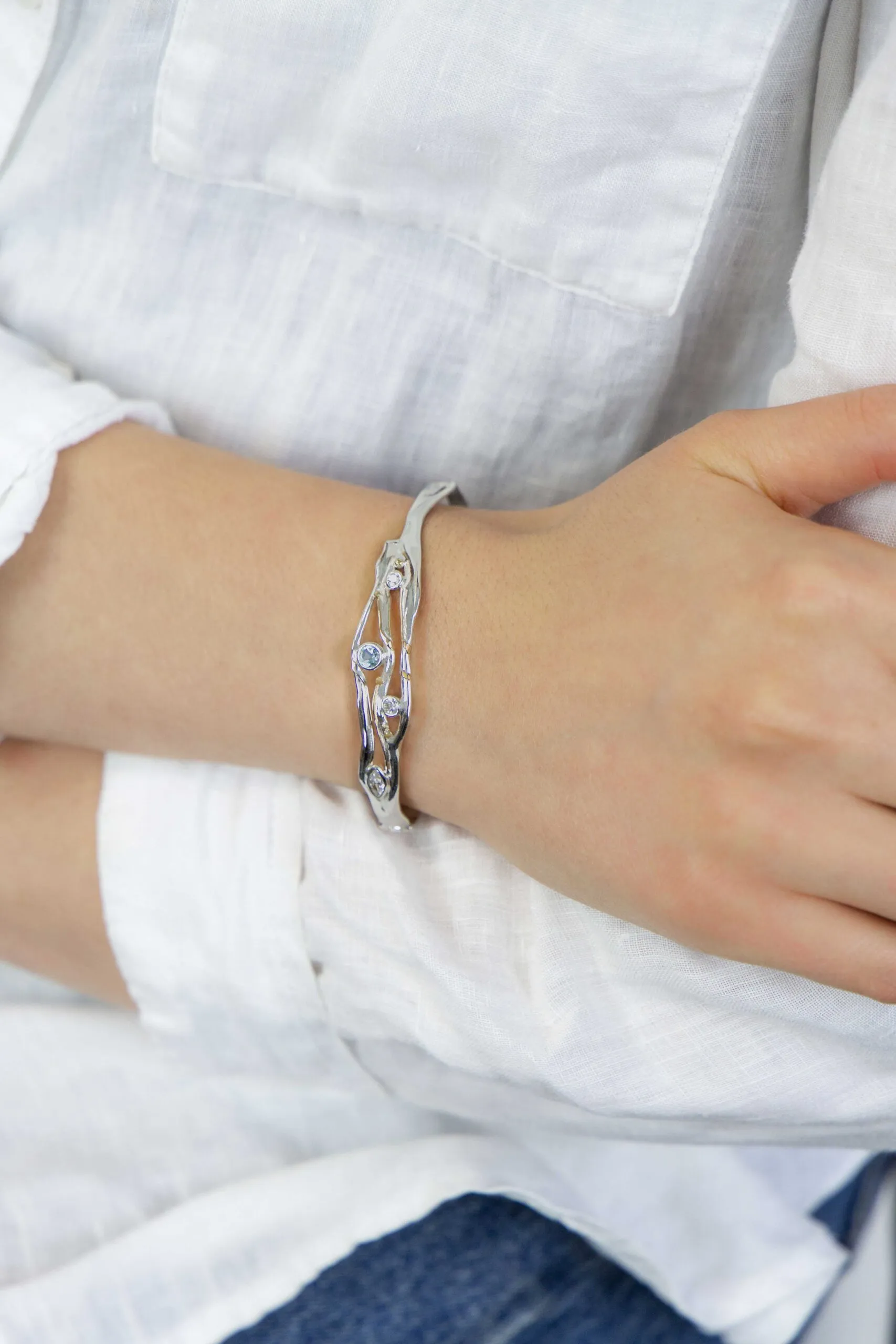 Banyan Hinged Silver Bangle with Blue Topaz and White CZ